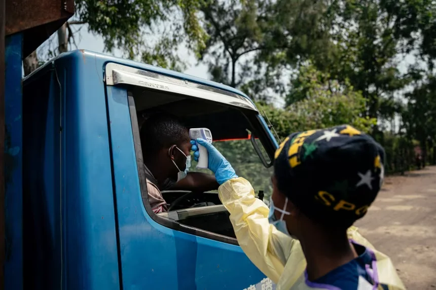 A visitor has their temperature checked before entering Kyeshero Hospital in Goma, Democratic Republic of Congo, on Monday. Jospin Mwisha/AFP/Getty Images