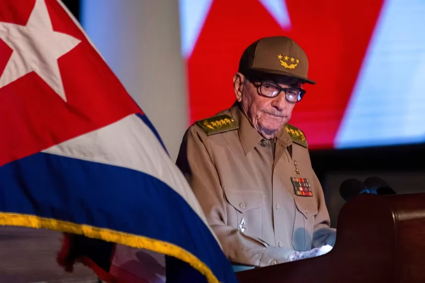 Former Cuban President Raul Castro looks at the Cuban flag during his speech at the event celebrating the 65th anniversary of the triumph of the revolution in Santiago, Cuba, on January 1, 2024. Ismael Francisco/AP