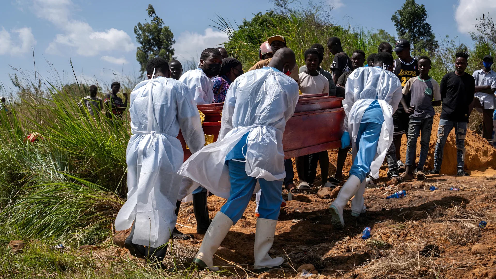 Health workers carry the coffin at the cemetery for the burial of a person suspected of having died from Ebola in Bunia, in the eastern Democratic Republic of the Congo, on May 25, 2026. Glody Murhabazi/AFP via Getty Images