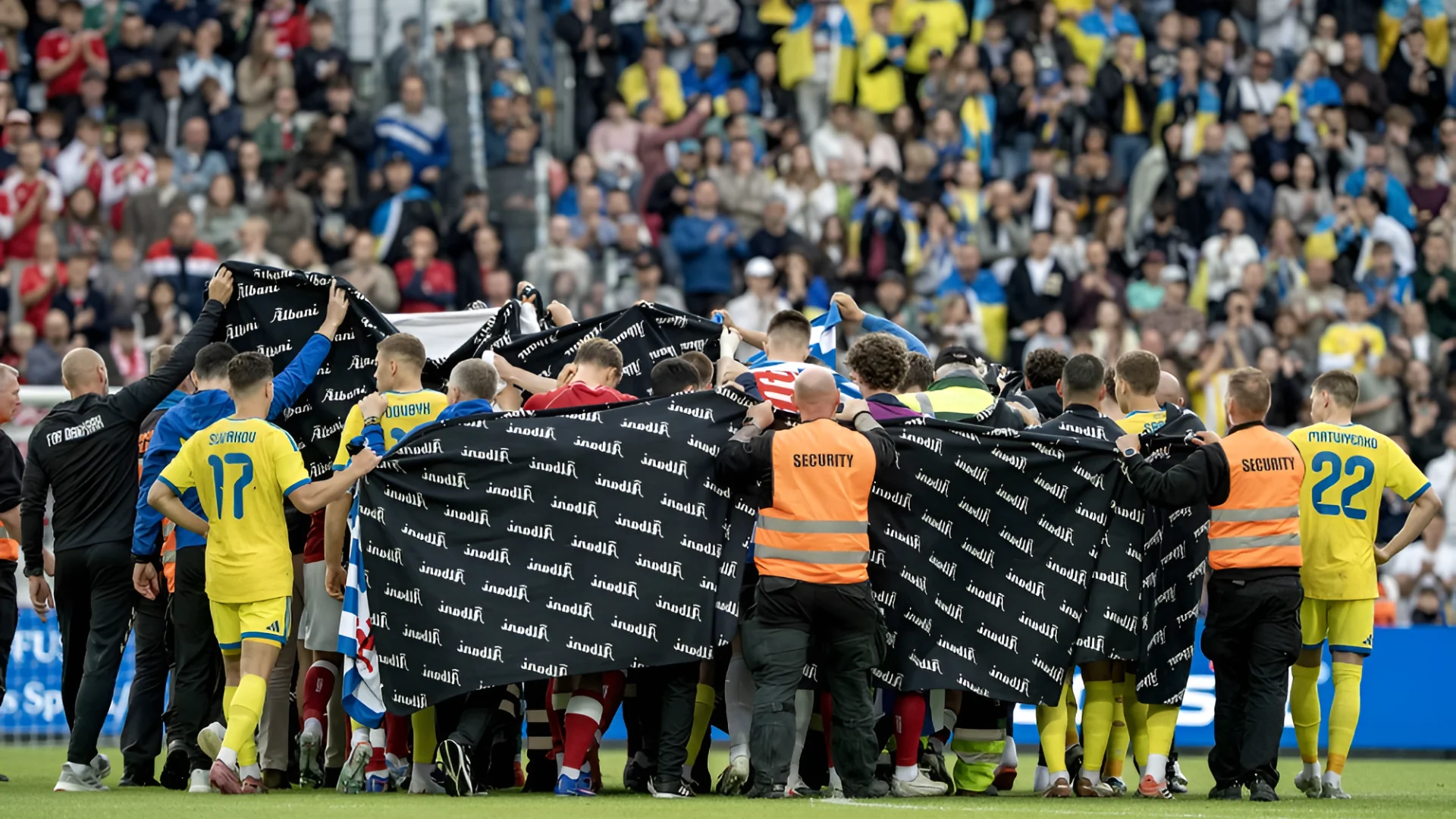 Players from Denmark's and Ukraine's teams huddle around Danish midfielder Christian Eriksen after he collapsed on the field during a friendly match Sunday.Bo Amstrup / Ritzau Scanpix/AFP via Getty Images