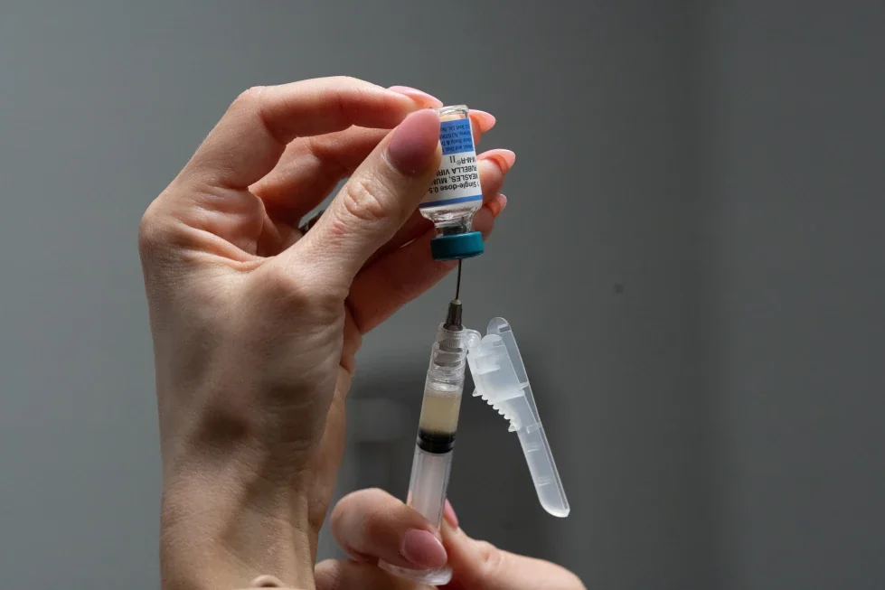 Lauren Ellenburg, a nurse, prepares a combination measles, mumps and rubella vaccine for a patient at Tiger Pediatrics in Easley, S.C., March 17, 2026. (AP Photo/Mary Conlon, File)