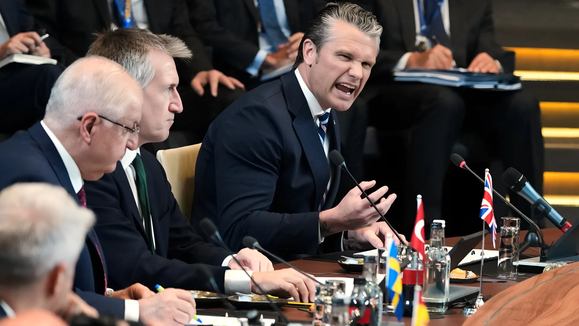 United States Defense Secretary Pete Hegseth, right, speaks during a meeting of the North Atlantic Council in defense ministers format at NATO headquarters in Brussels, Thursday, June 18, 2026. (AP Photo/Virginia Mayo)