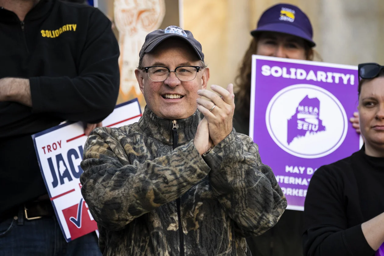 Matt Dunlap applauds during a May Day rally organized by local unions outside City Hall in Portland, Maine, on on May 1, 2026. | Graeme Sloan/Getty Images