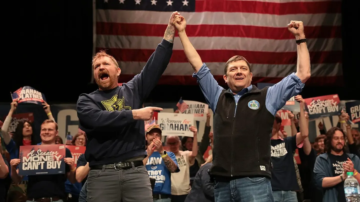 Democratic U.S. Senate candidate Graham Platner and gubernatorial candidate Troy Jackson stand together during a 