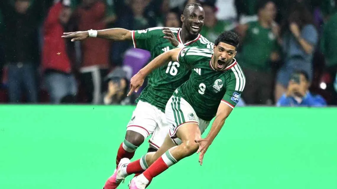 Raúl Jiménez celebrates scoring Mexico's second goal against Ecuador with teammate Julián Quiñones. CARL DE SOUZA / AFP via Getty Images
