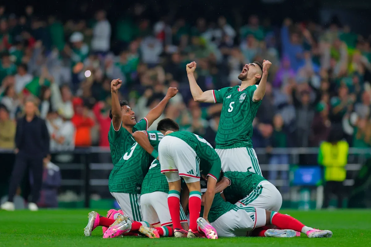 Mexico players celebrate after Raul Jiménez's 31st-minute goal in their 2-0 World Cup win over Ecuador. (Jam Media via Getty Images)