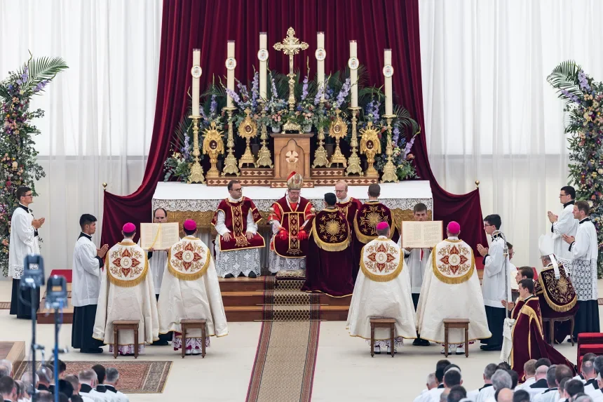 Alfonso de Galarreta from Spain, Bishop of the Society of Saint Pius X, center, gives episcopal consecration to four new bishops. Cyril Zingaro/Keystone/AP