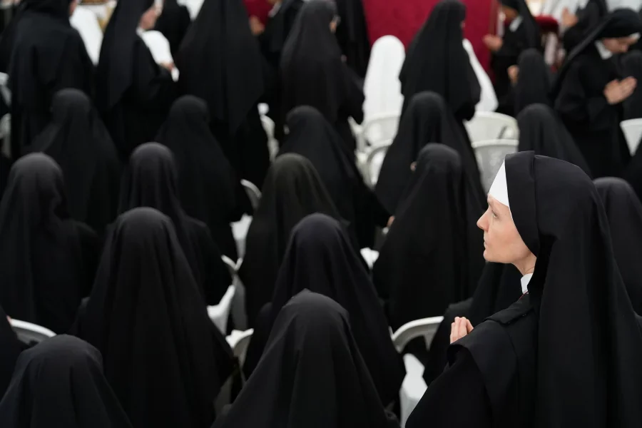 Nuns attend a consecration ceremony for four new bishops in a tent set up outside the Society of St. Pius X seminary, in Econe, Switzerland, Wednesday, July 1, 2026. Baz Ratner/AP