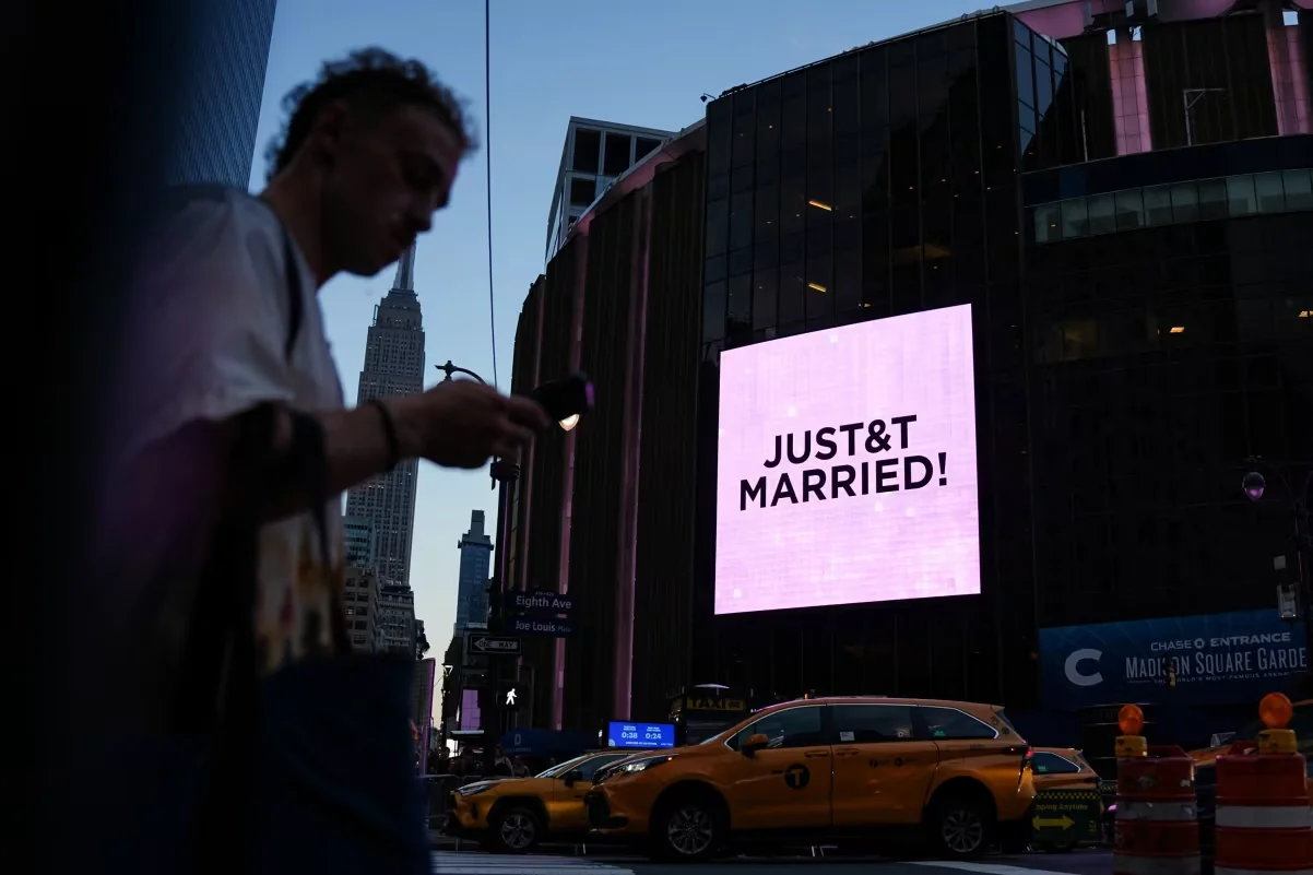 A screen displays a message referencing Taylor Swift and Travis Kelce outside Madison Square Garden in New York on Friday. Angelina Katsanis/Reuters