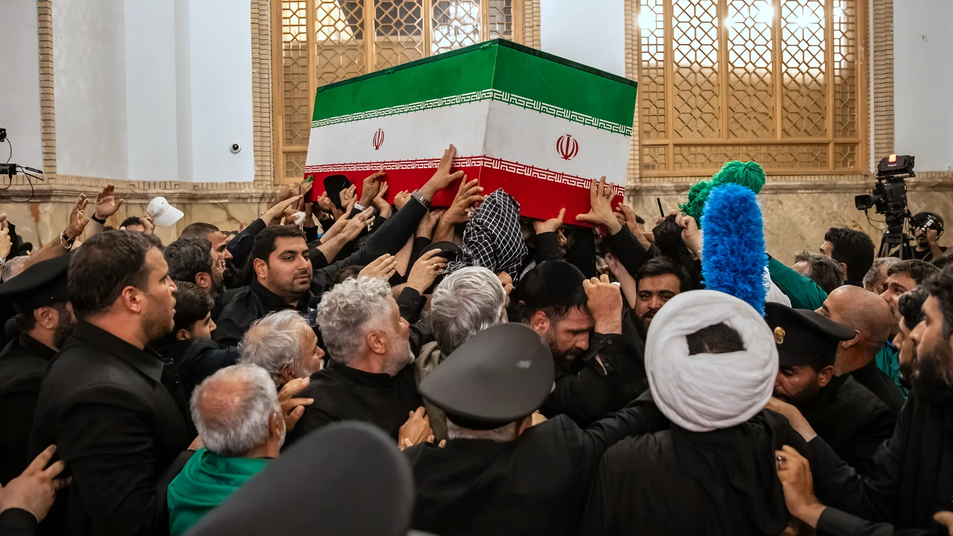 In this photo released by Iran's Supreme Leader's office, mourners carry the coffin of the late Iranian Supreme Leader A