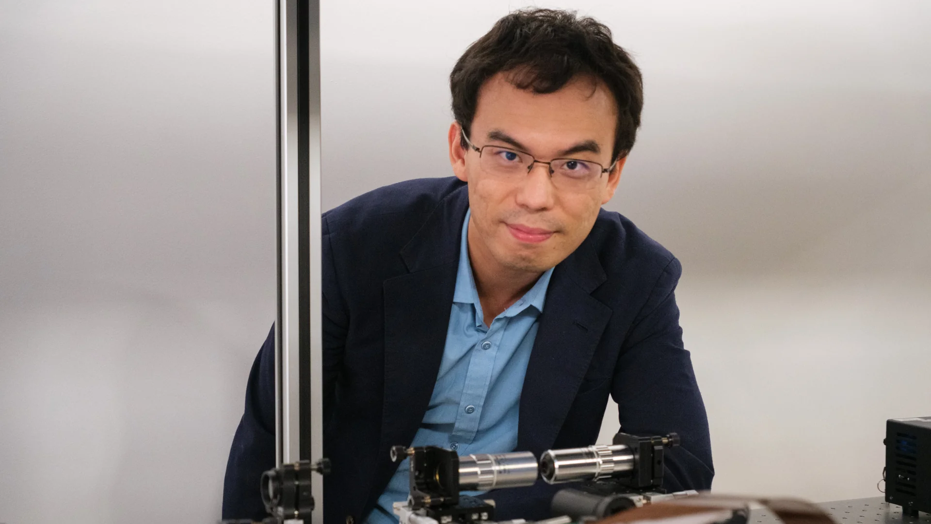 NAP Shen Yijie with the equipment used to make optical skyrmions. Credit: ntu.edu.sg