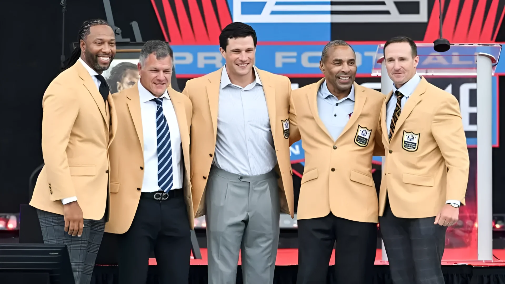 From left, Larry Fitzgerald, Adam Vinatieri, Luke Kuechly, Roger Craig and Drew Brees pose for photos during their Pro F