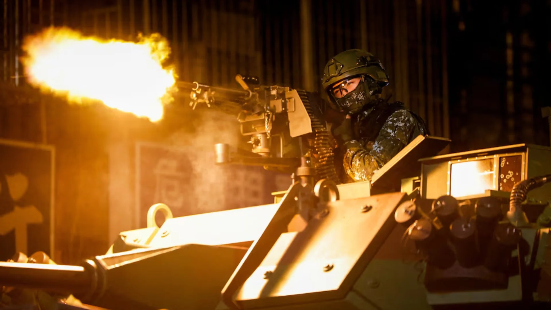 Taiwanese soldier firing from an armored vehicle during the Han Kuang exercise. Photo: REUTERS/Ann Wang.