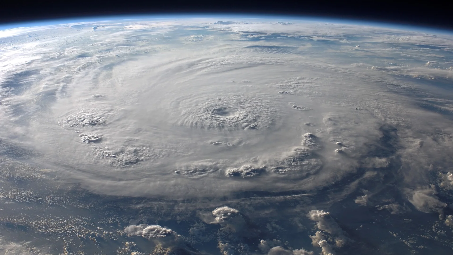 Aerial view of Earth showing a massive swirling storm and atmospheric patterns. Photo: Pixabay.